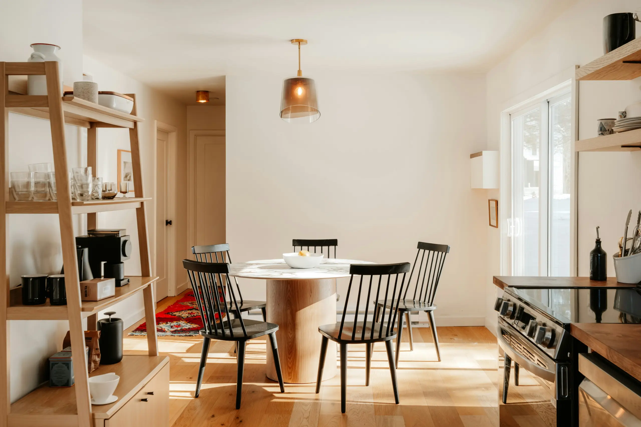 Sunlit dining nook with round table
